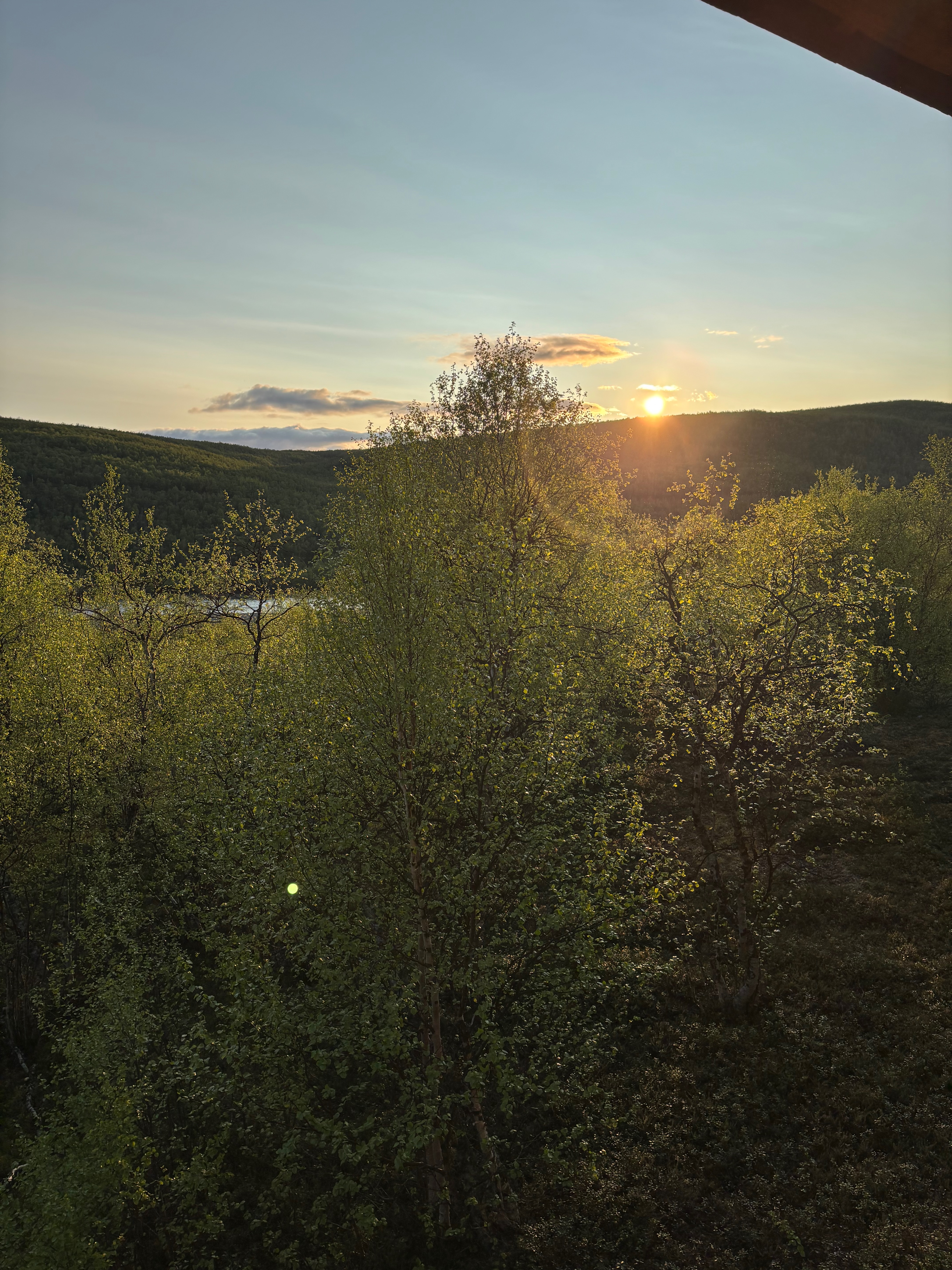 Midnight sun over river