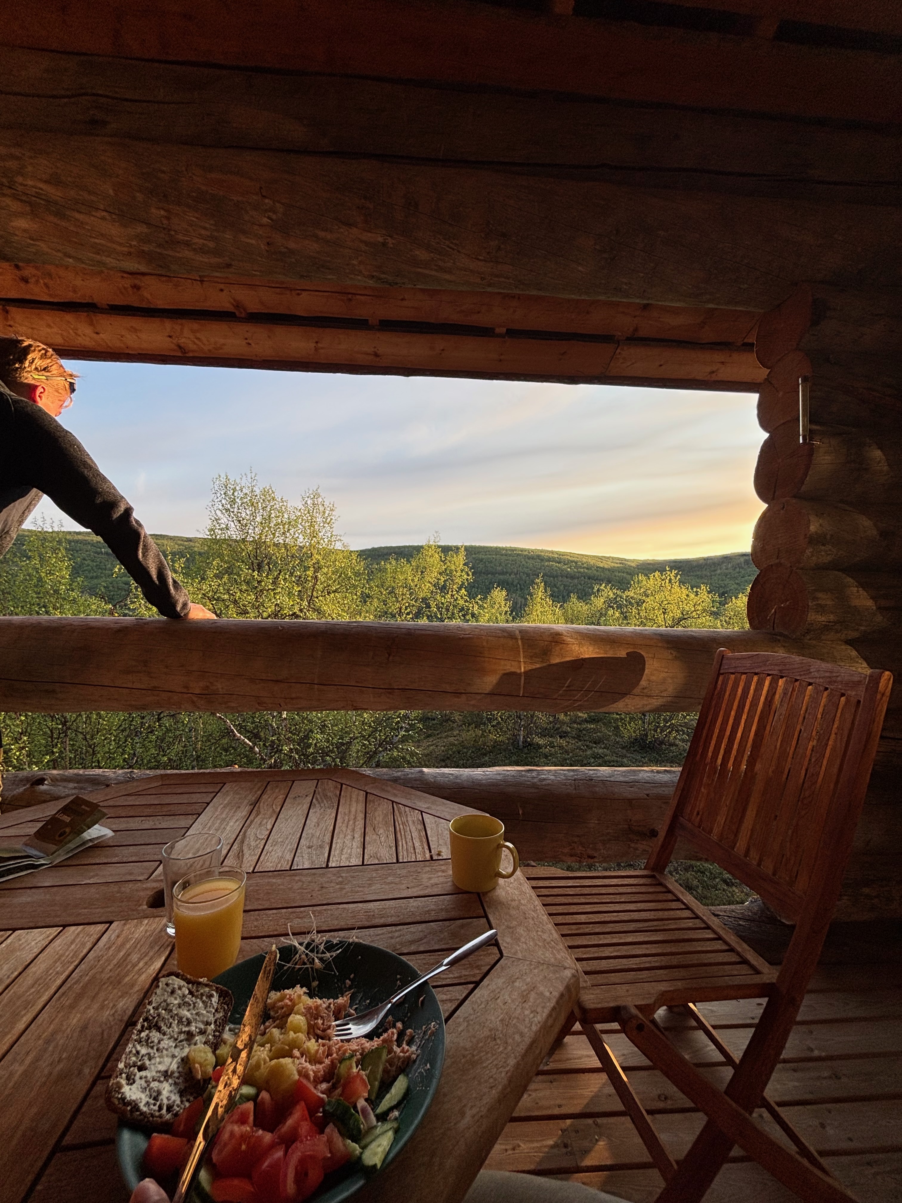 Dinner plate on terrace with fell sunset panorama